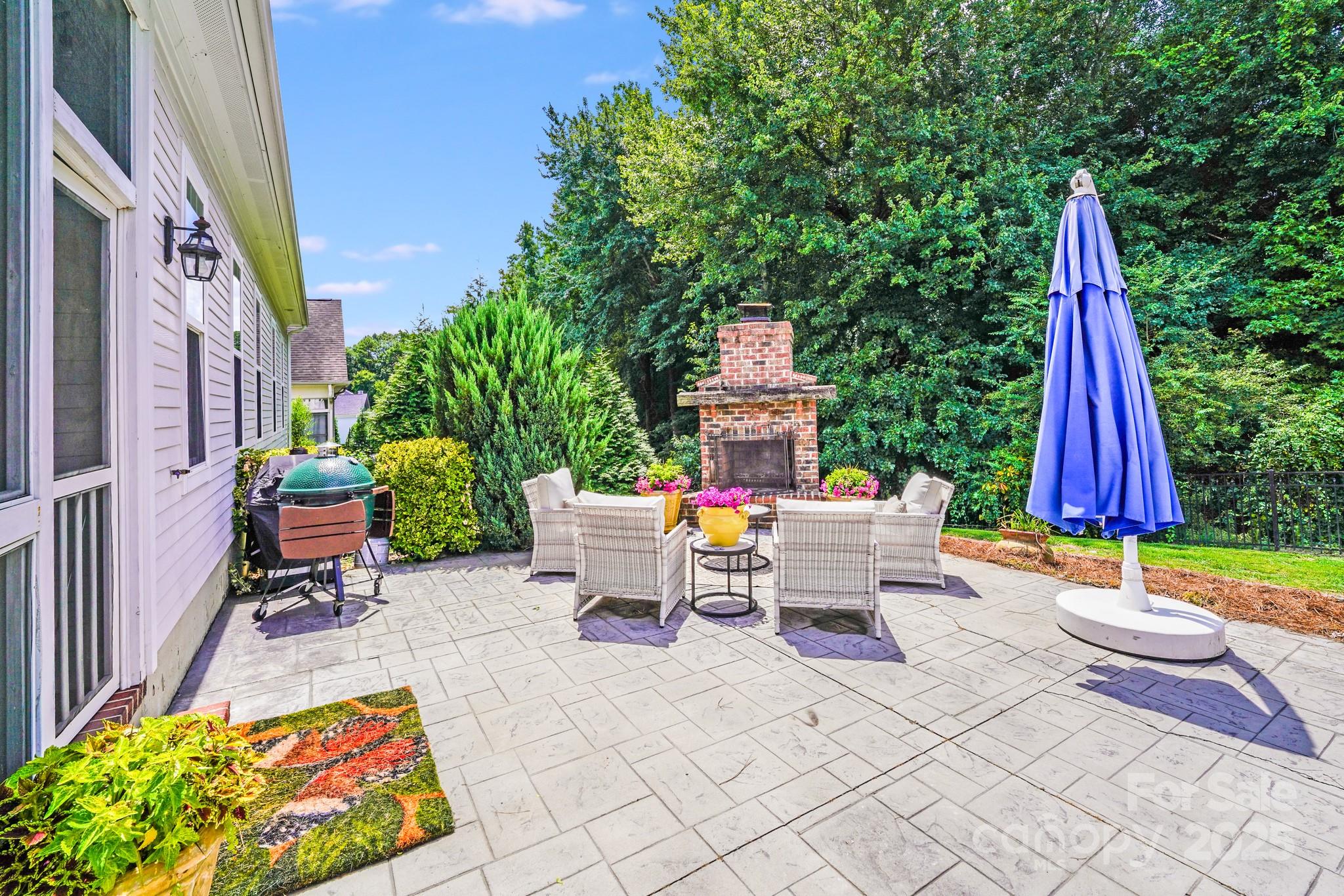 2702 Arsdale Road Waxhaw, NC 28173 - Photo 44 of 48 a view of a patio with a table and chairs