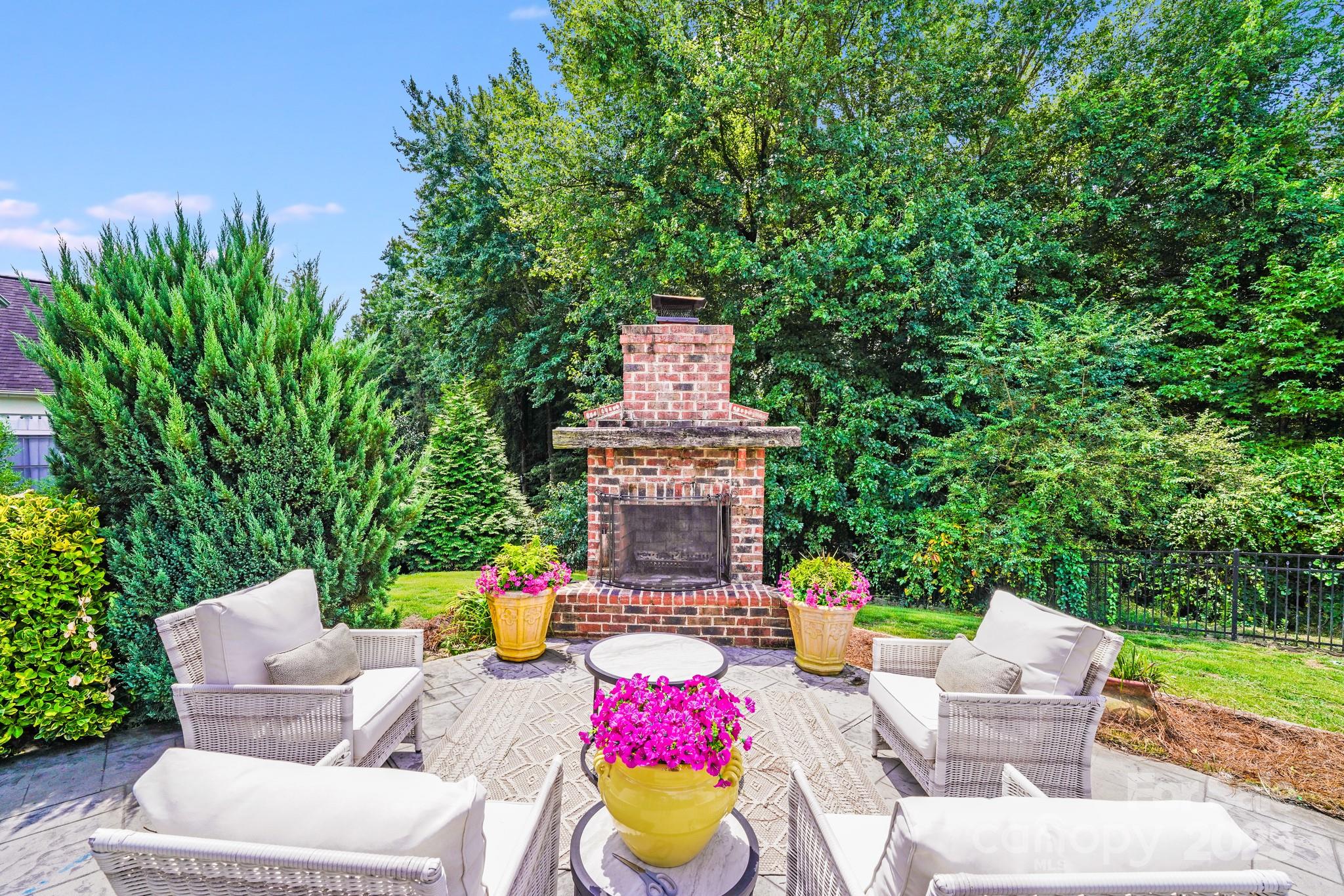 2702 Arsdale Road Waxhaw, NC 28173 - Photo 45 of 48 a view of a chairs and table in backyard of the house