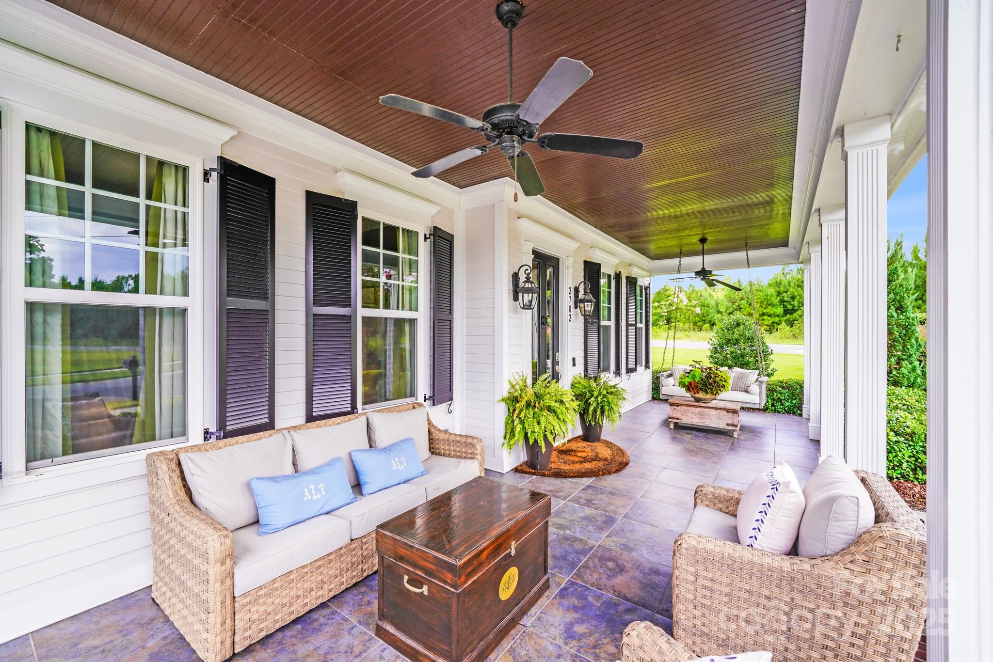 2702 Arsdale Road Waxhaw, NC 28173 - Photo 6 of 48 a view of a patio with couches and potted plants