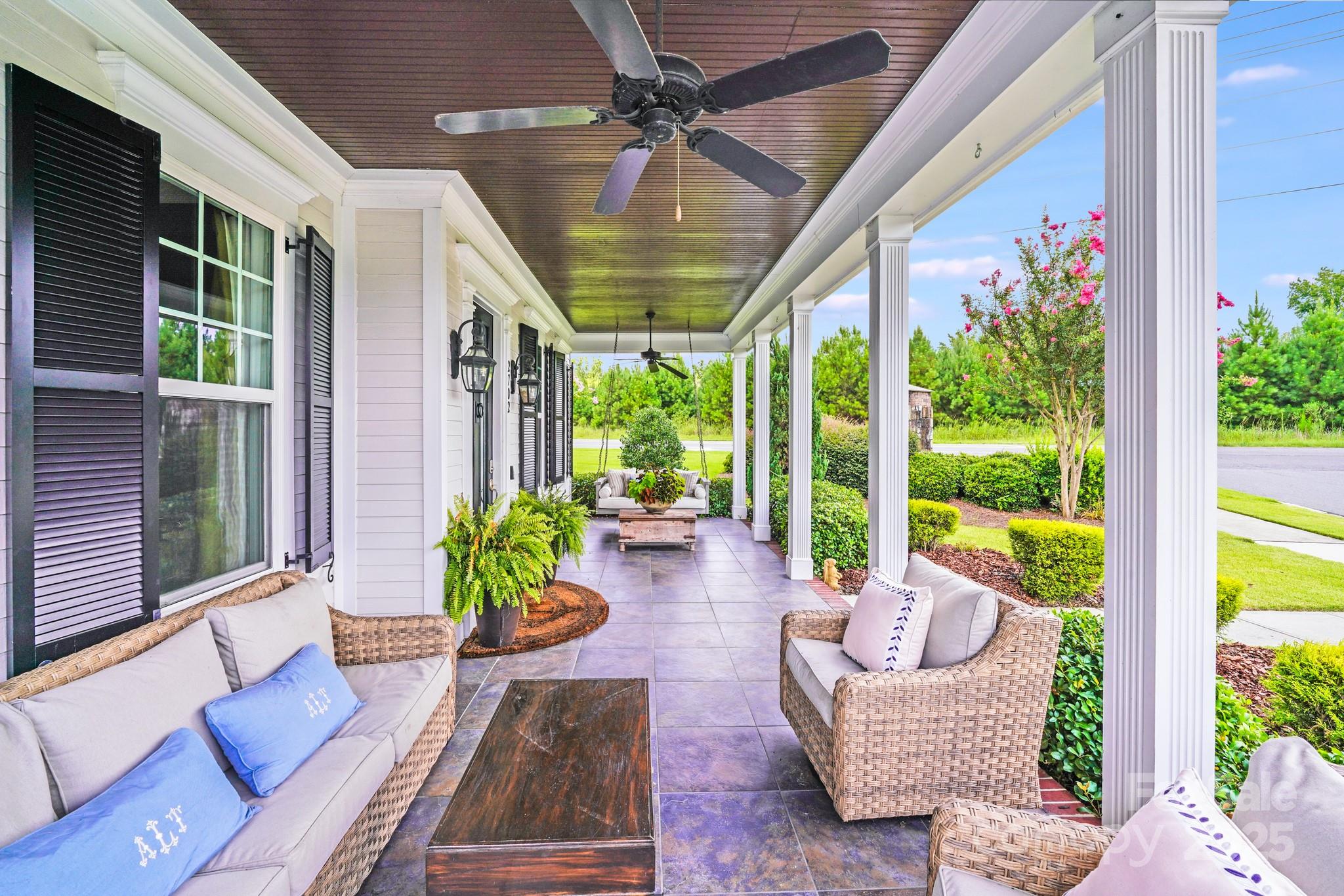 2702 Arsdale Road Waxhaw, NC 28173 - Photo 7 of 48 a living room with patio furniture and a potted plant