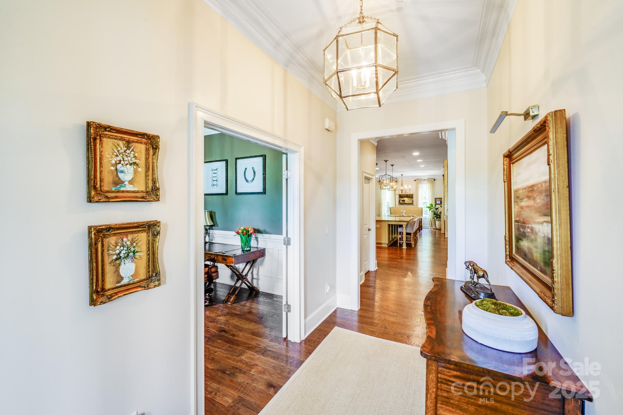 2702 Arsdale Road Waxhaw, NC 28173 - Photo 8 of 48 a living room with furniture and a chandelier