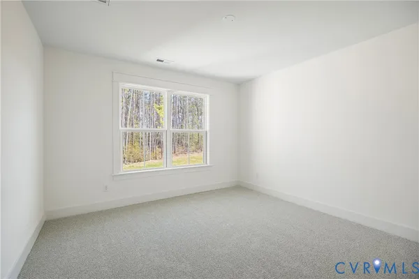 an empty room with window and window