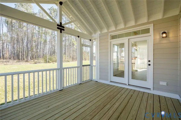 a view of a livingroom with a dishwasher and a window