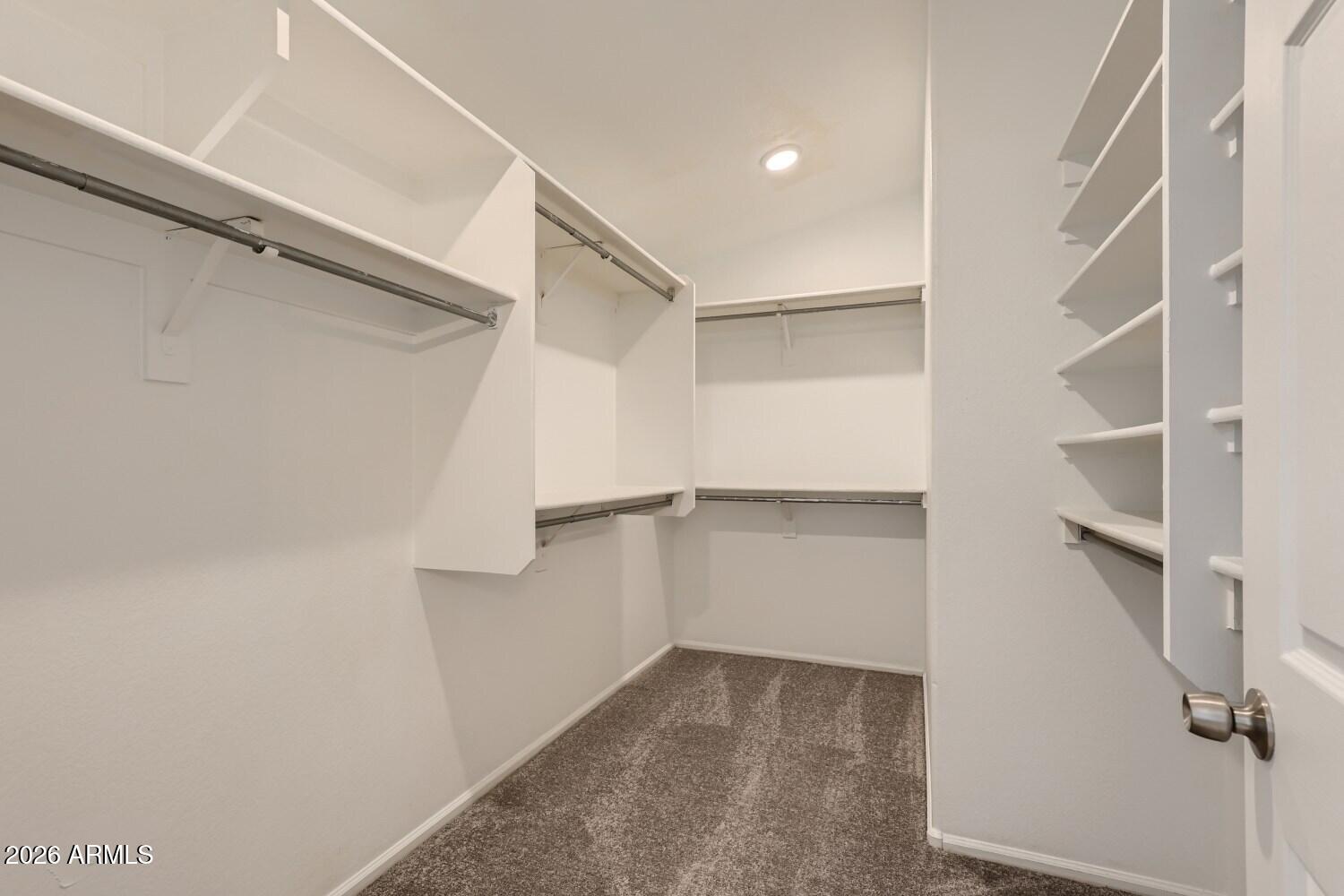 16033 West Diamond Street Goodyear, AZ 85338 - Photo 20 of 28 a view of an empty walk in closet