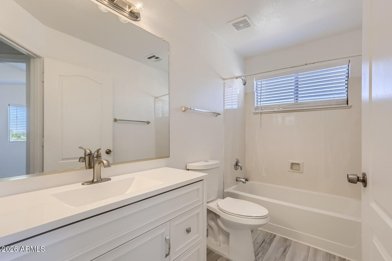 16033 West Diamond Street Goodyear, AZ 85338 - Photo 22 of 28 a bathroom with a sink a toilet and shower