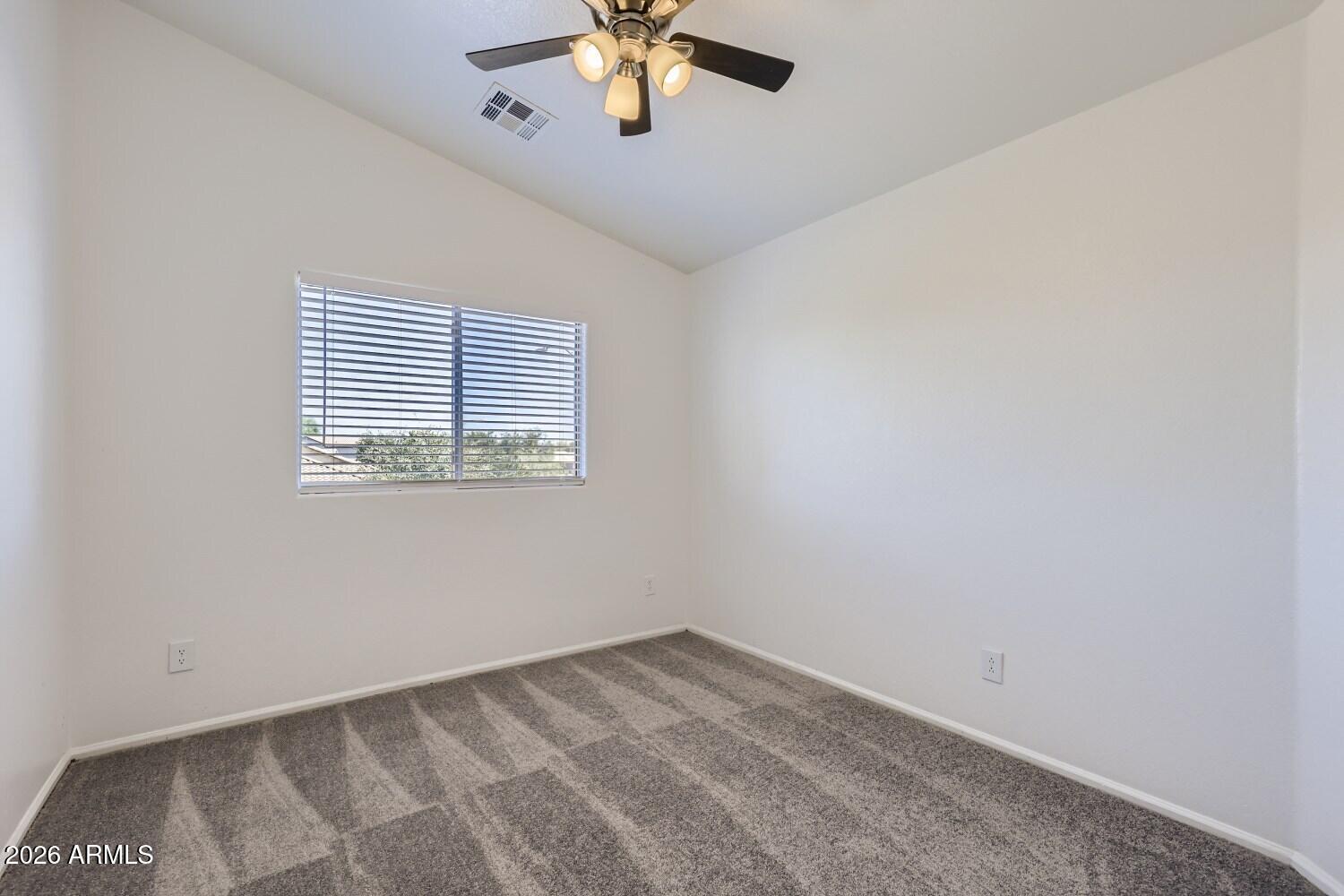 16033 West Diamond Street Goodyear, AZ 85338 - Photo 23 of 28 an empty room with a window