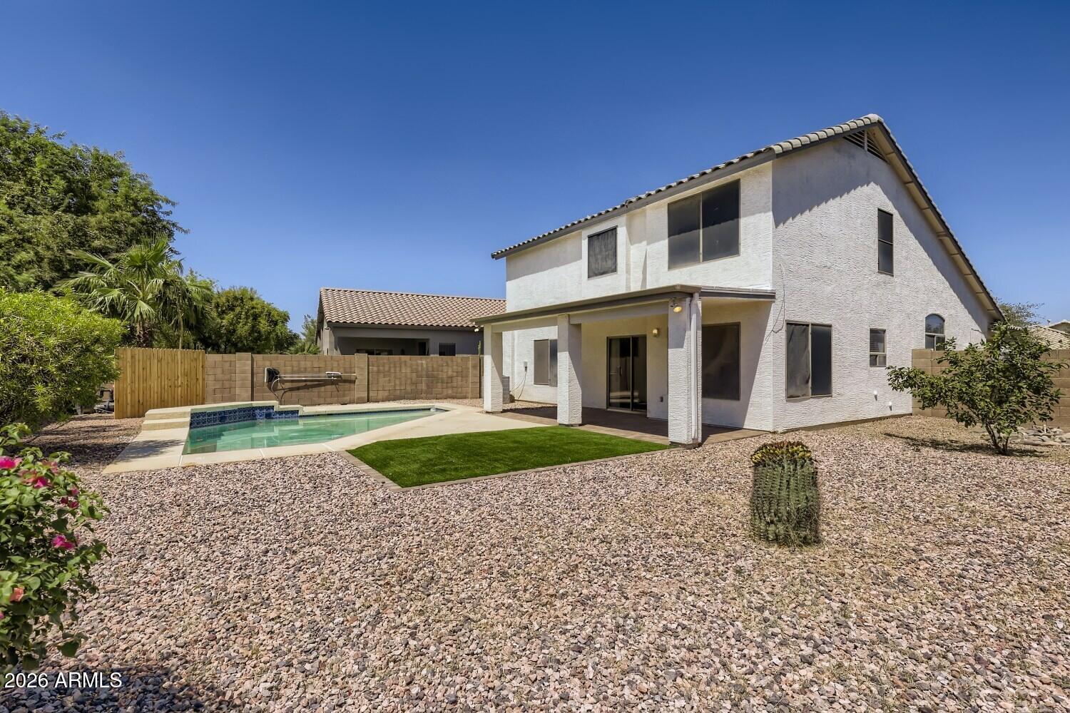 16033 West Diamond Street Goodyear, AZ 85338 - Photo 26 of 28 a front view of a house with garden