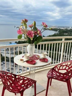 a kitchen with granite countertop a sink a stove and a refrigerator