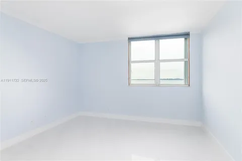 a view of a chairs and table in the balcony