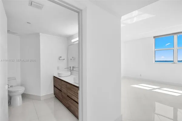 a bathroom with a sink double vanity and a mirror