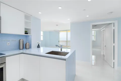 a bathroom with a window and a shower