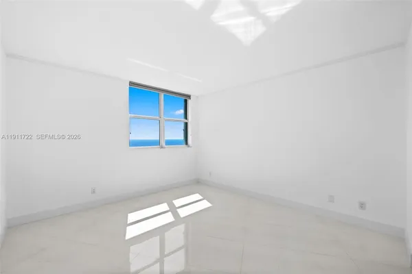 a view of an empty room with windows