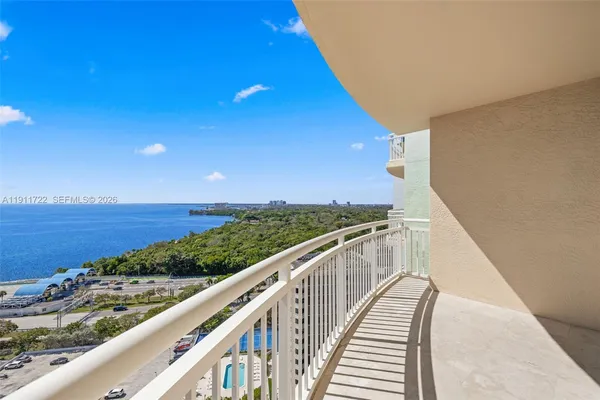 a view of balcony and wooden floor