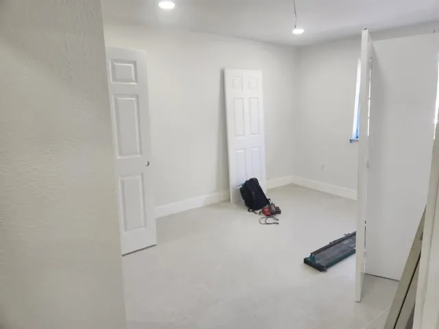 a room with furniture and a potted plant