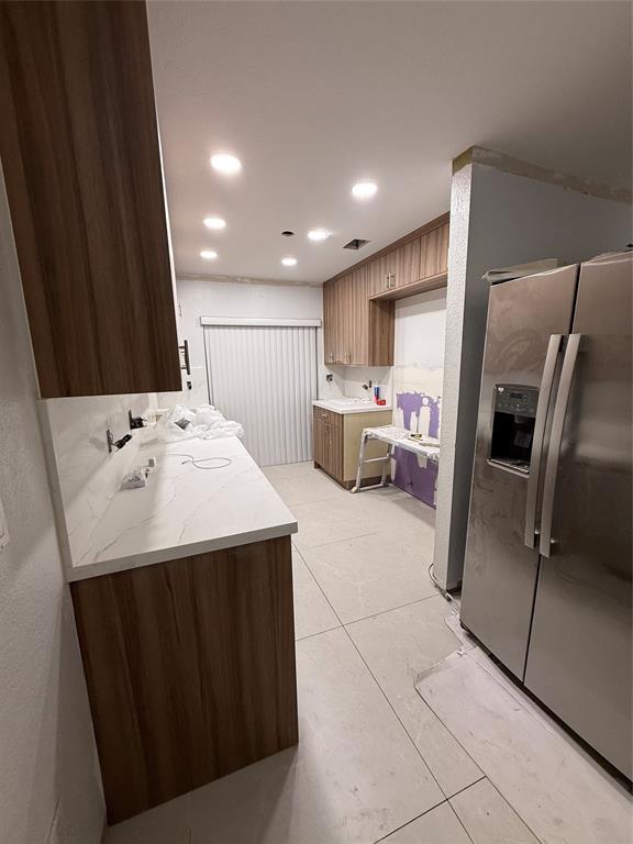 3526 West 76th Street, Unit 203 Hialeah, FL 33018 - Photo 5 of 13 a kitchen with stainless steel appliances a refrigerator sink and microwave