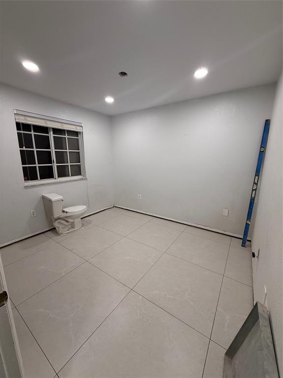 3526 West 76th Street, Unit 203 Hialeah, FL 33018 - Photo 8 of 13 a view of an empty room with a window