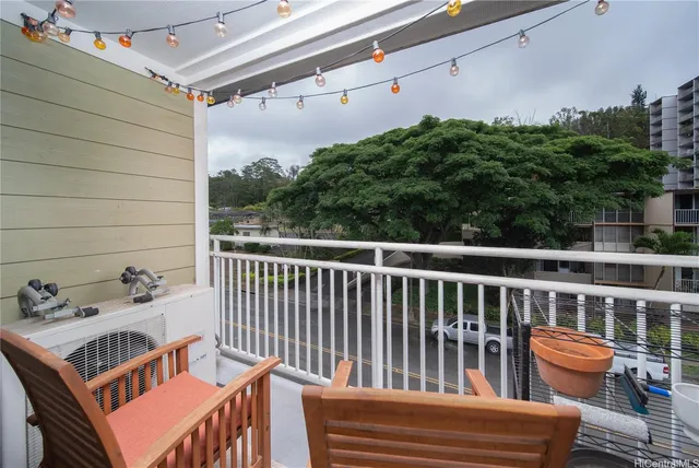 a view of balcony with furniture