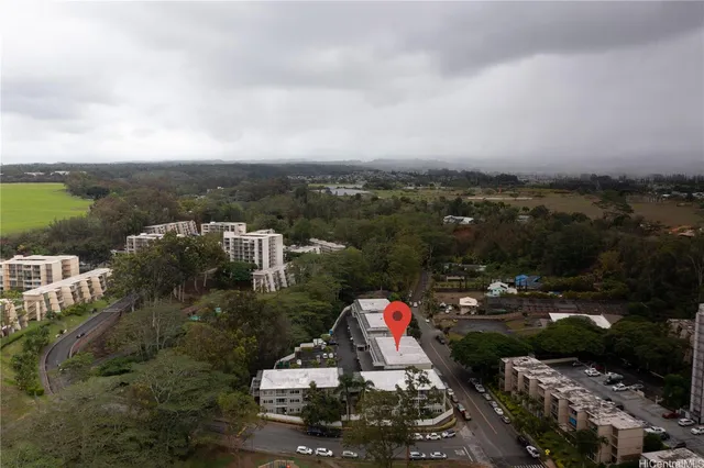 a view of a lake with couches and city view