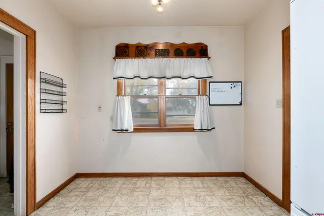 wooden floor and fireplace with windows