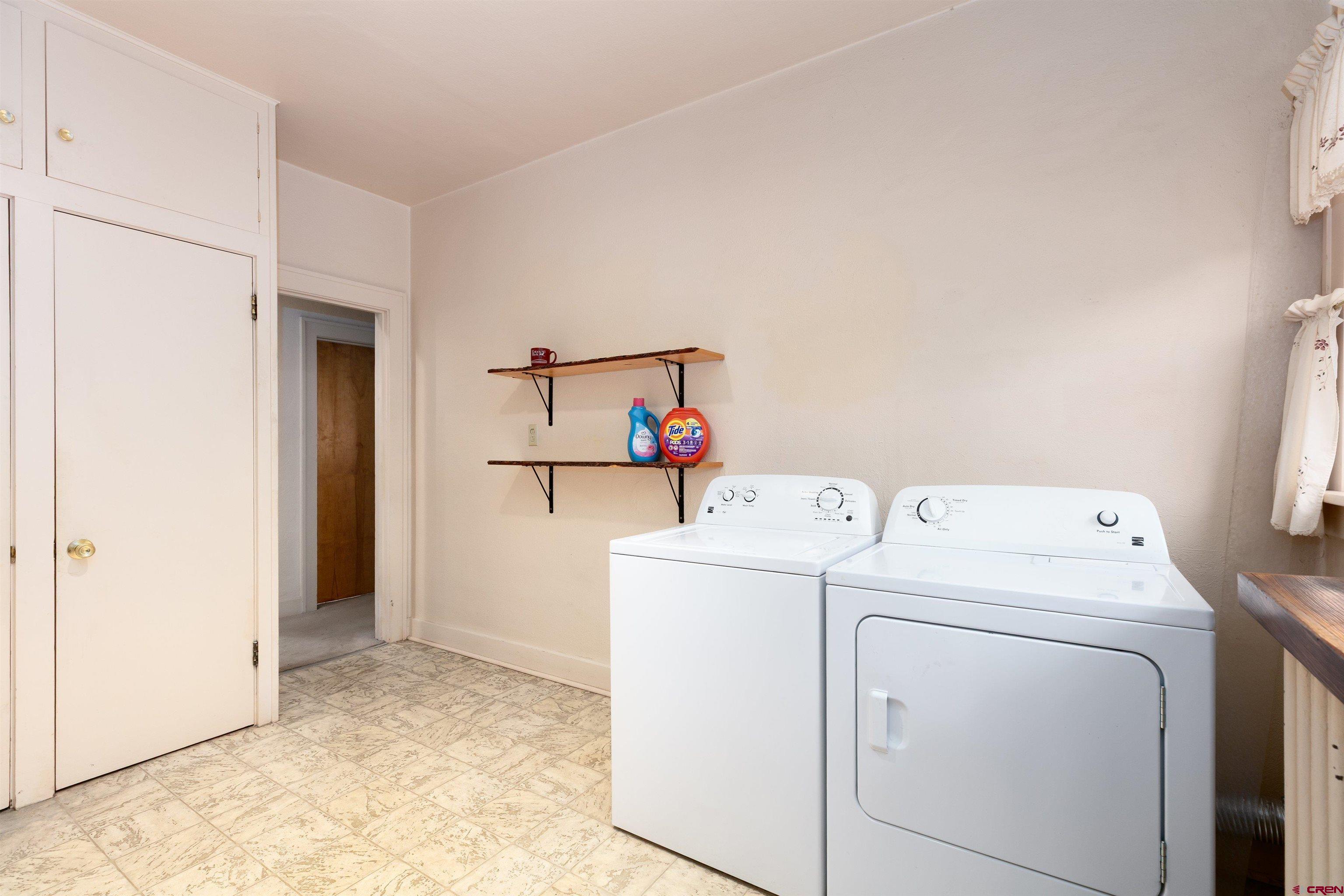 705 Oak Street Del Norte, CO 81132 - Photo 26 of 44 a view of storage and utility room with washer and dryer
