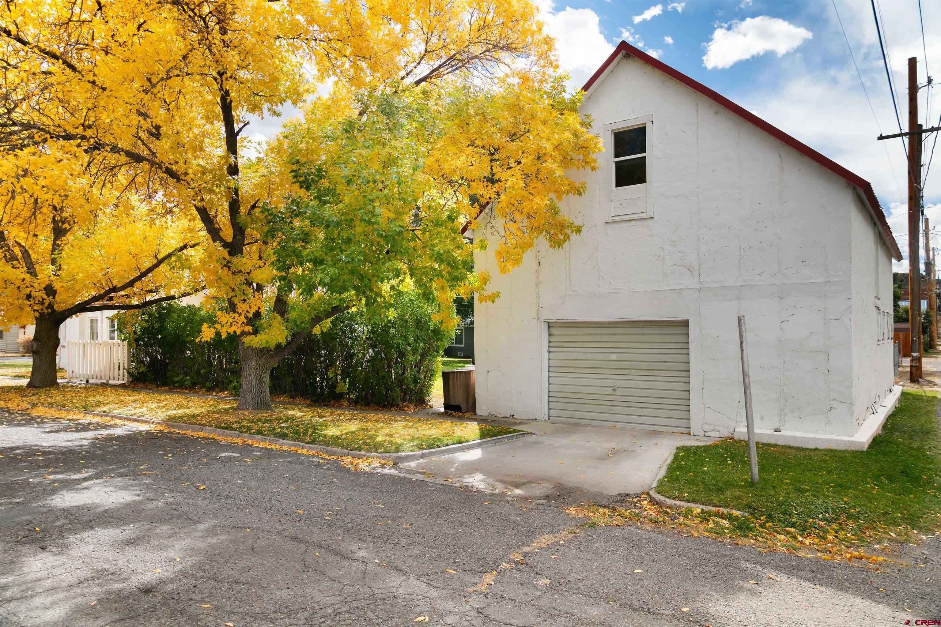 705 Oak Street Del Norte, CO 81132 - Photo 3 of 44 a house with trees in front of it