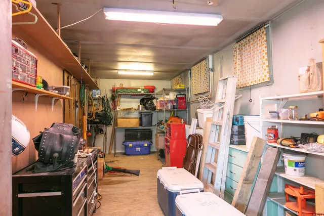 a view of a chairs and table in backyard