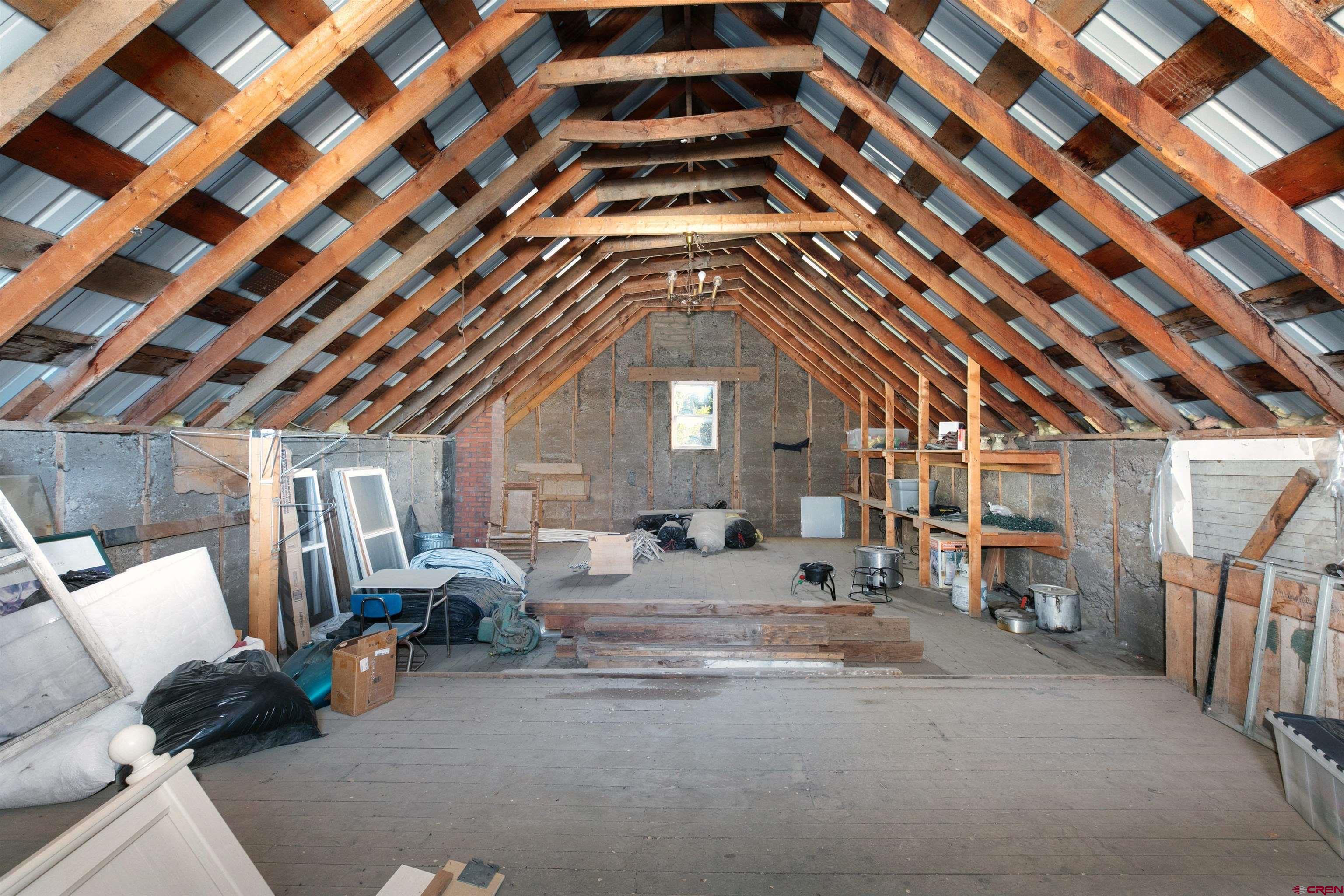 705 Oak Street Del Norte, CO 81132 - Photo 34 of 44 a view of an empty room with wooden floor