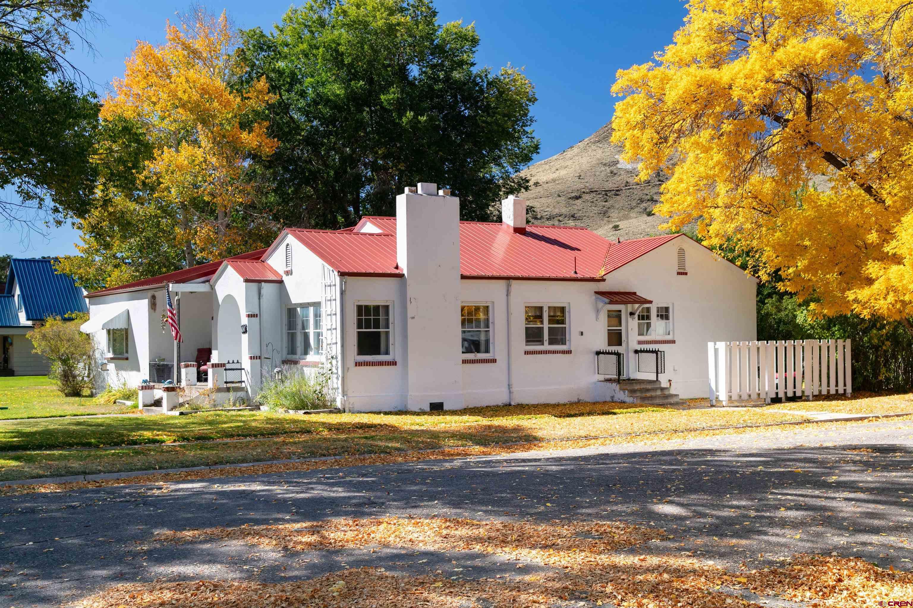 705 Oak Street Del Norte, CO 81132 - Photo 38 of 44 a view of the house with a swimming pool