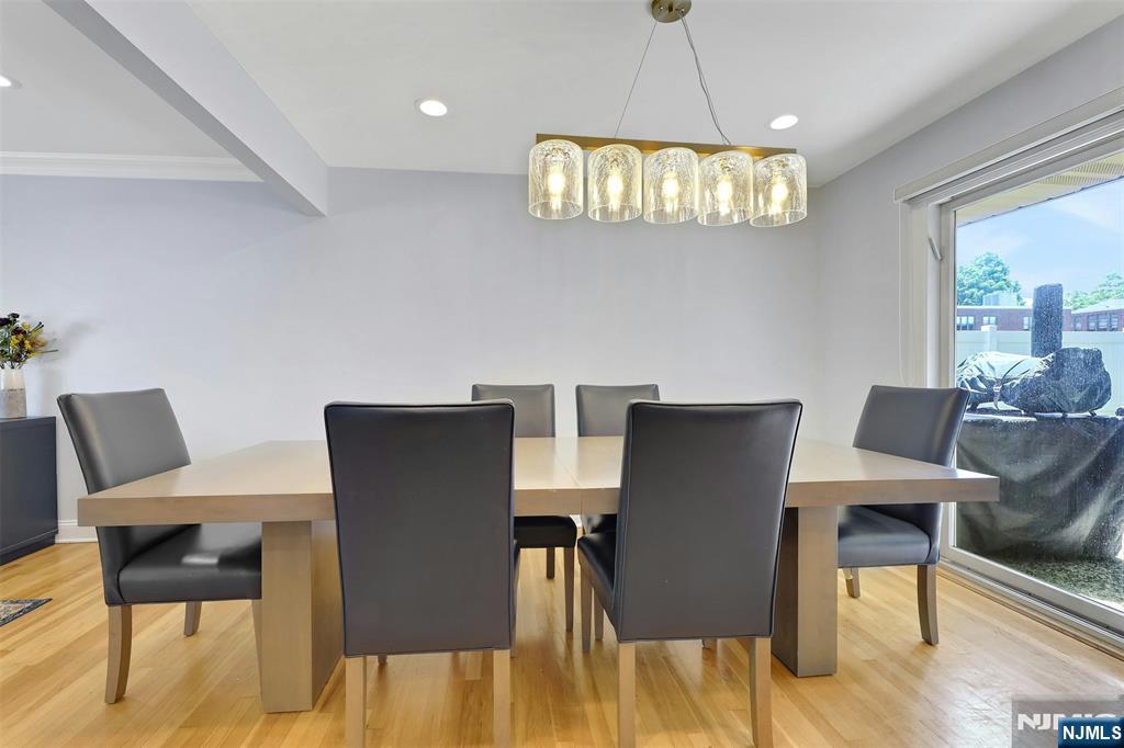 514 Rutland Avenue Teaneck, NJ 07666 - Photo 12 of 40 a view of a dining room with furniture and wooden floor