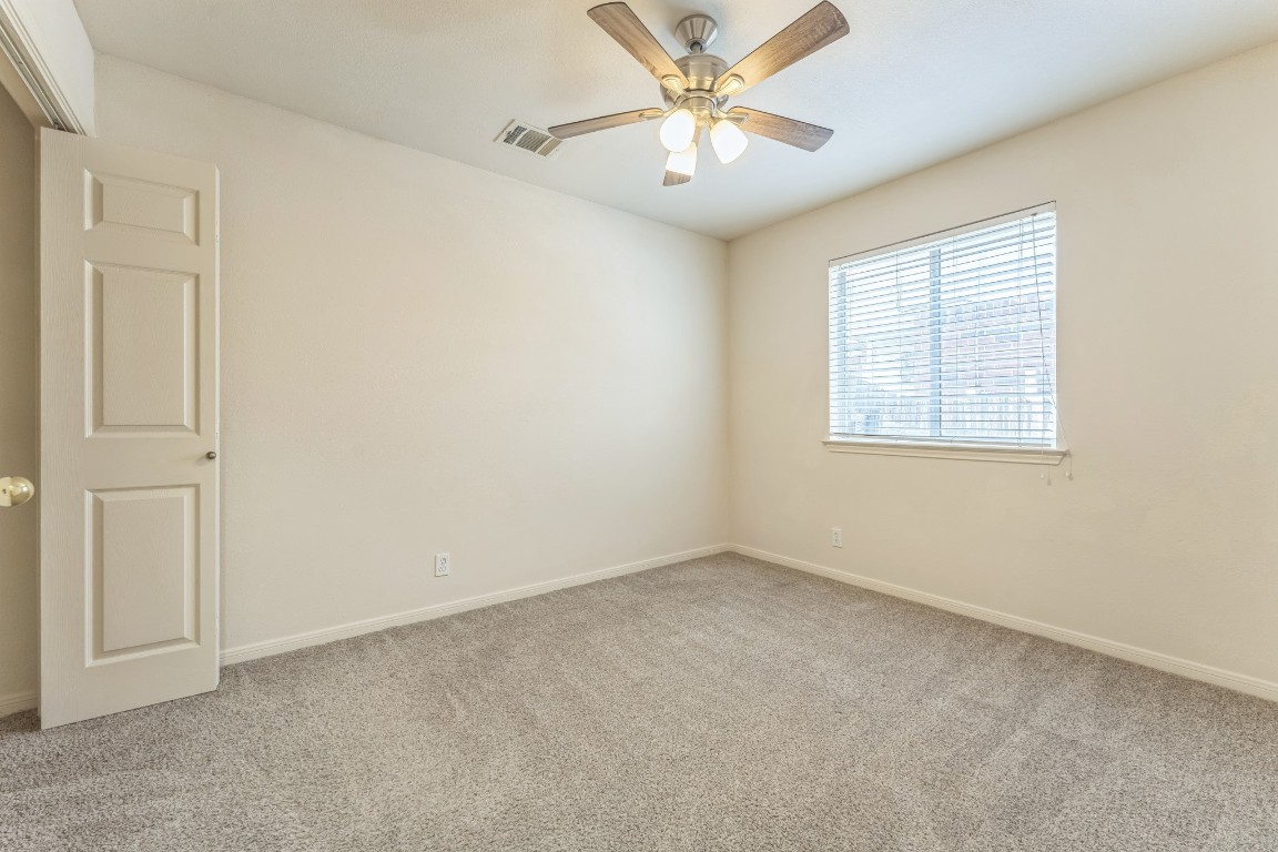 21308 Secretariat Ridge Lane Pflugerville, TX 78660 - Photo 17 of 18 Carpeted spare room featuring baseboards and a ceiling fan