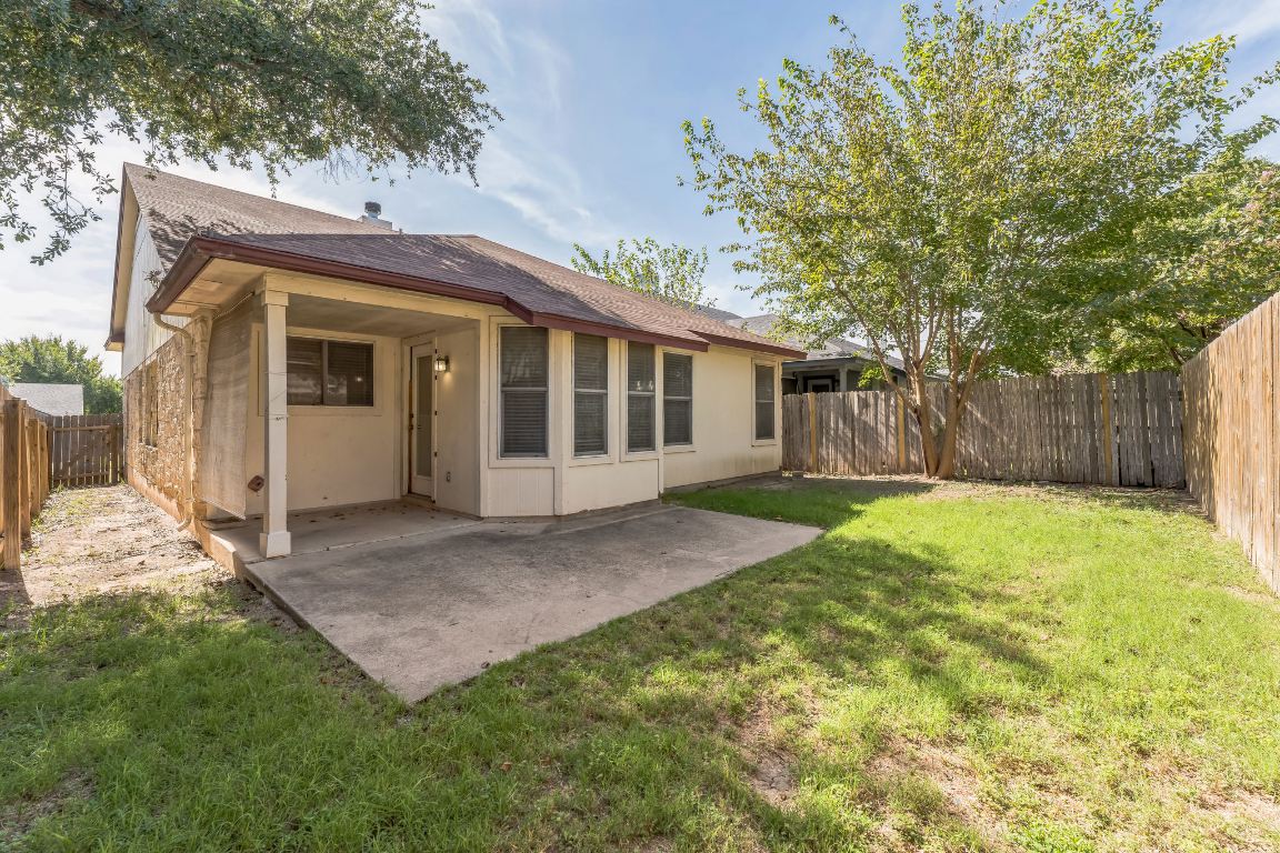21308 Secretariat Ridge Lane Pflugerville, TX 78660 - Photo 4 of 18 Rear view of house featuring a patio area, a fenced backyard, and a shingled roof