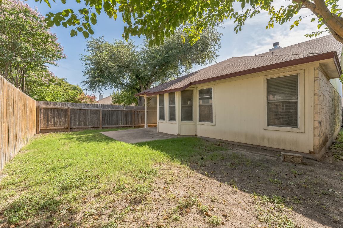 21308 Secretariat Ridge Lane Pflugerville, TX 78660 - Photo 5 of 18 Fenced backyard with a patio