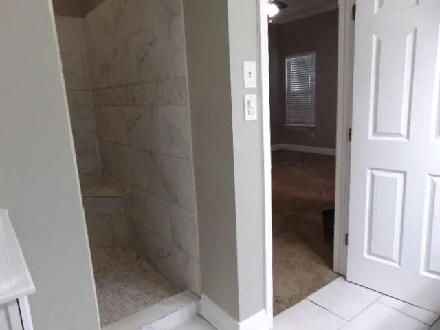 a view of a bathroom from a hallway