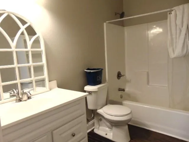a bathroom with a toilet and a sink