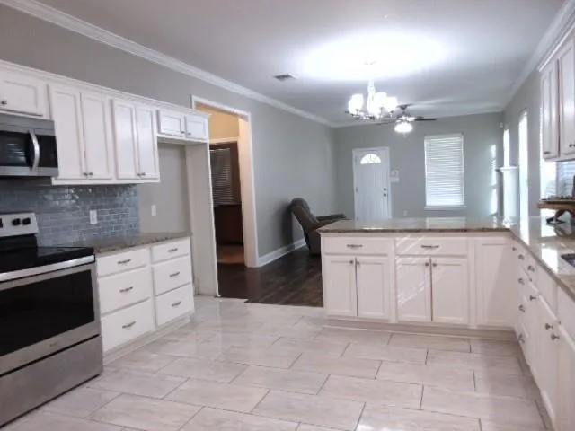 a large kitchen with cabinets