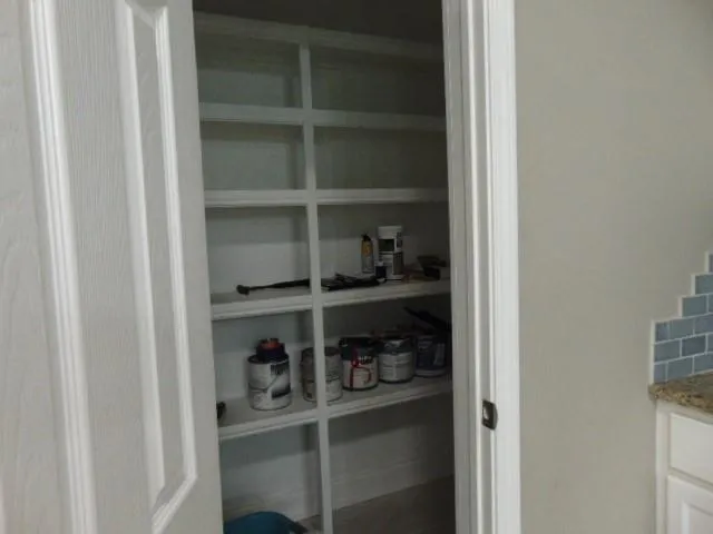 a room with a wooden floor and closet