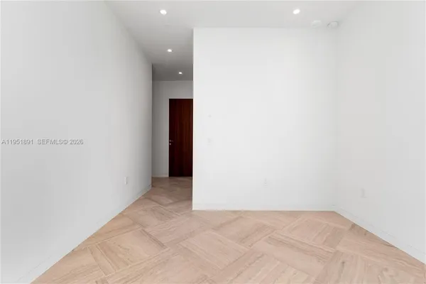 a view of a kitchen with dryer and white door