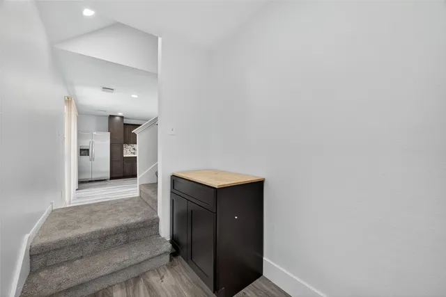 a view of a hallway with washer and dryer