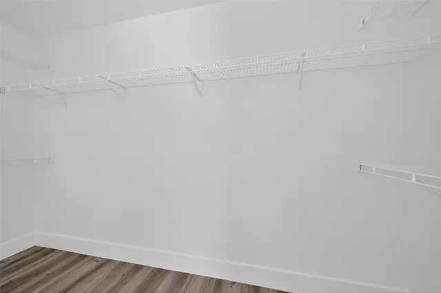 a view of a room with racks on the wall