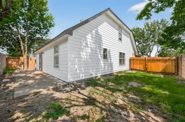a view of backyard with small cabin