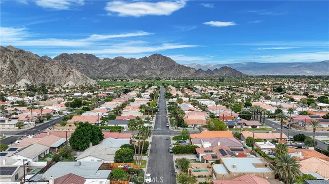 a view of a city with mountains in the background