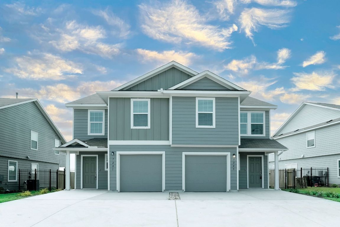 a front view of a house with a garage