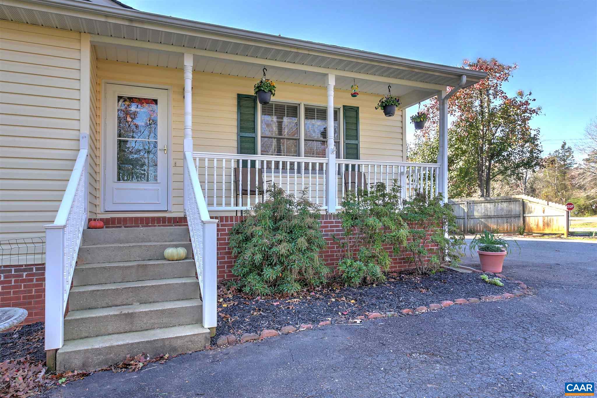 8 Daisy Road Ruckersville, VA 22968 - Photo 1 of 26 a view of a house with a small yard and wooden floor and fence