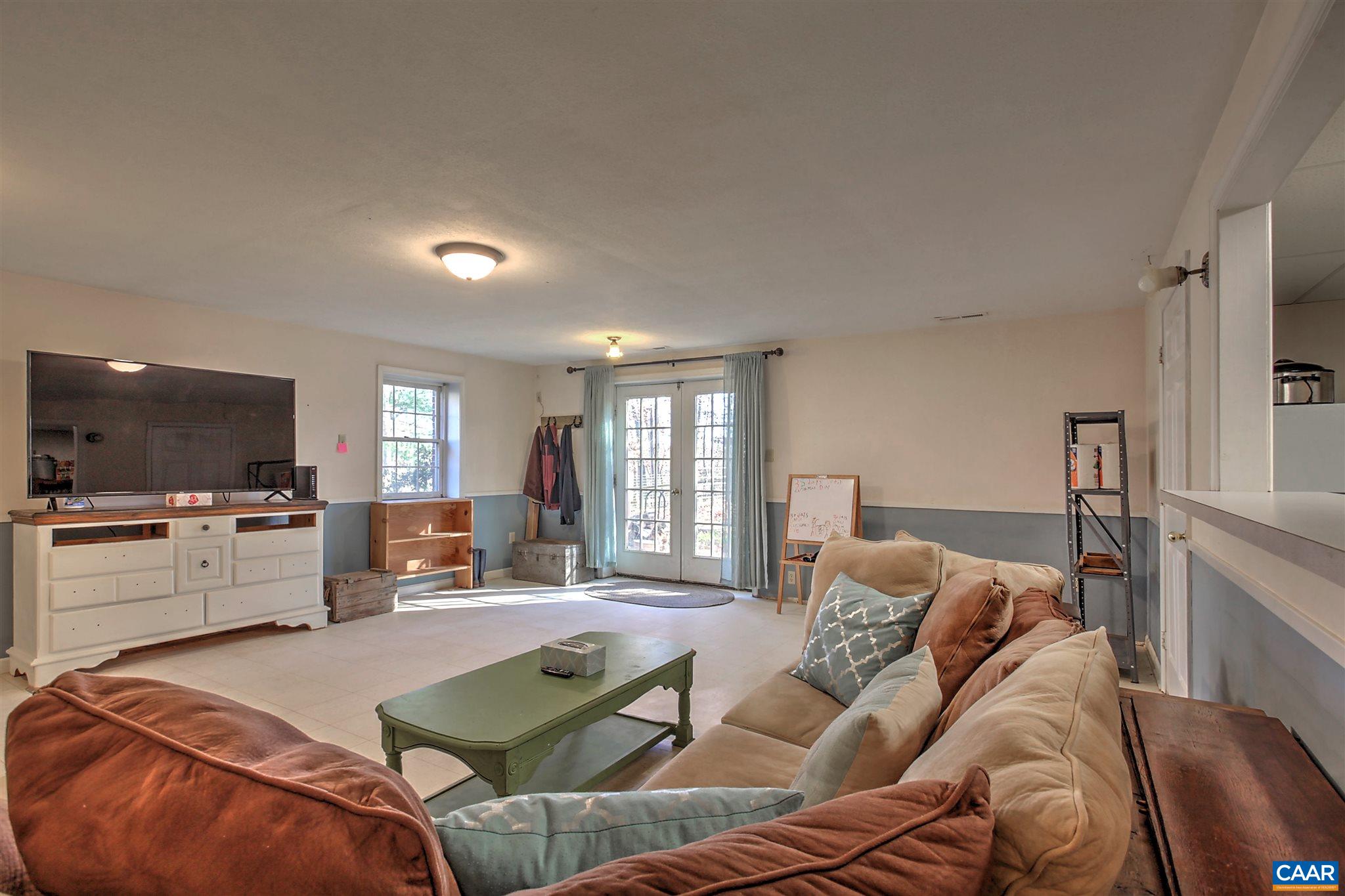 8 Daisy Road Ruckersville, VA 22968 - Photo 21 of 26 a living room with furniture and a flat screen tv