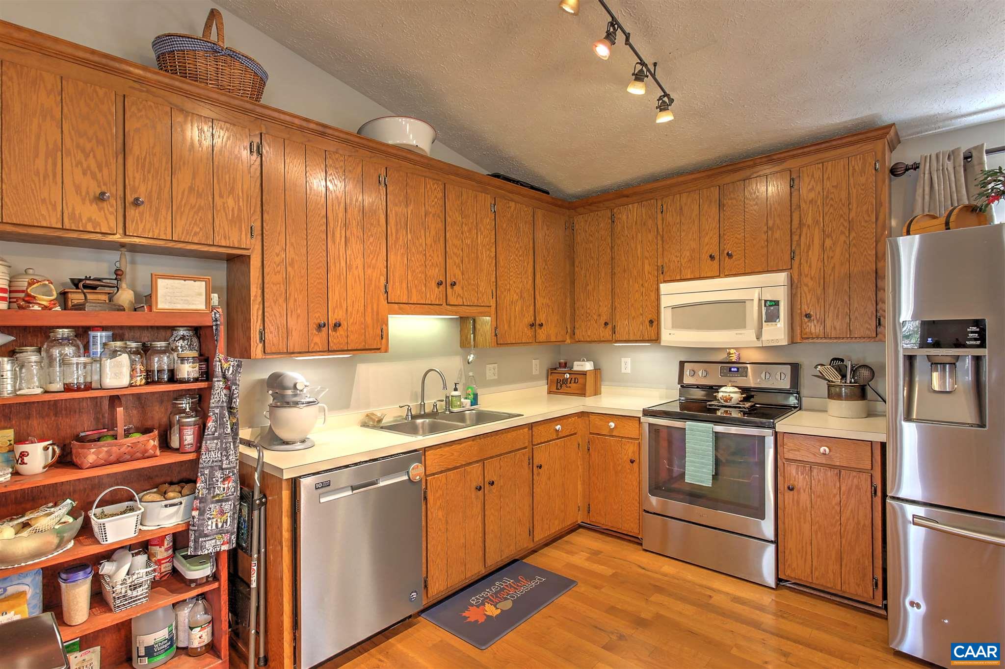 8 Daisy Road Ruckersville, VA 22968 - Photo 9 of 26 a kitchen with a sink window and cabinets