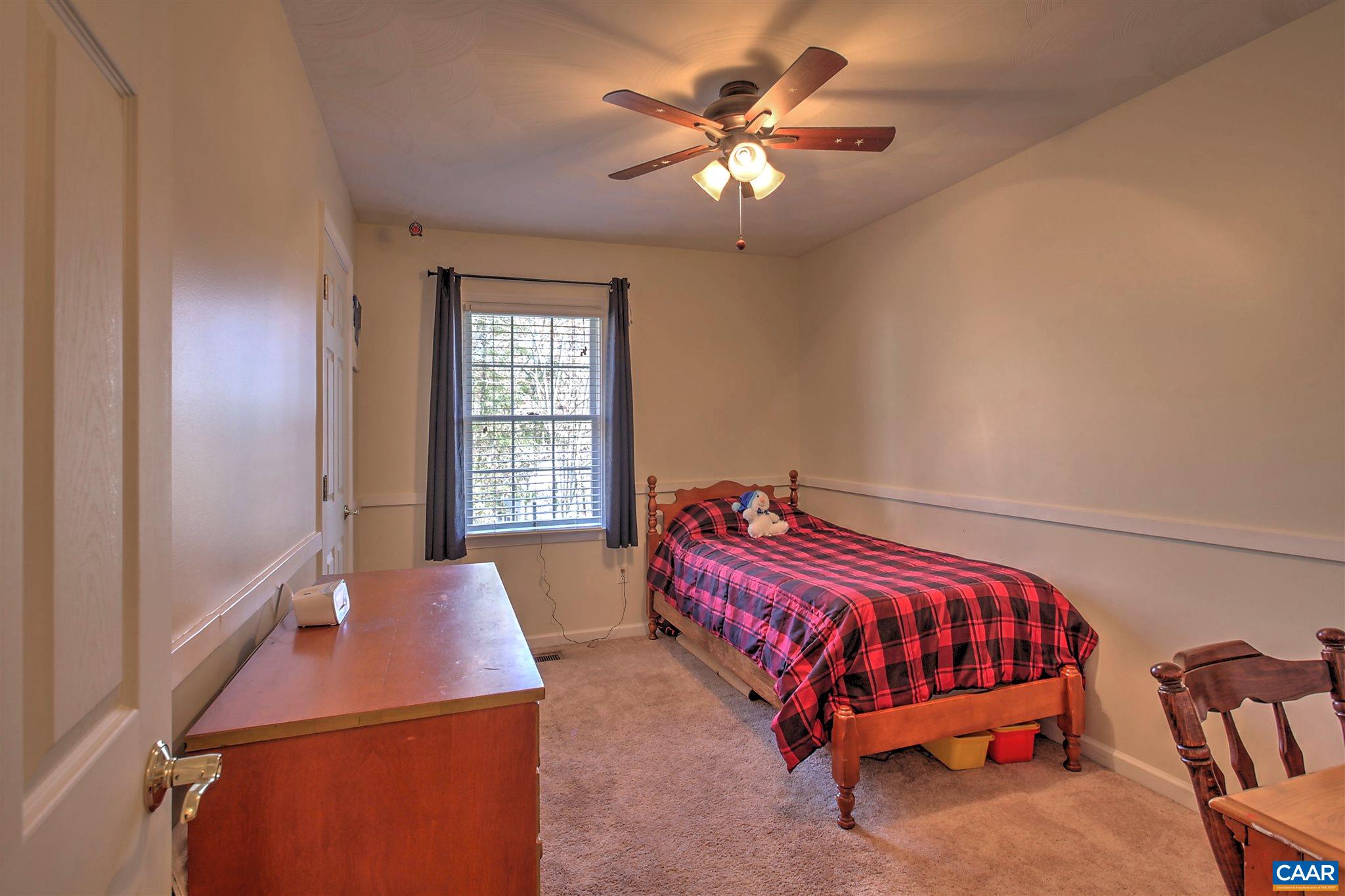 8 Daisy Road Ruckersville, VA 22968 - Photo 10 of 26 a bedroom with a bed and a chandelier