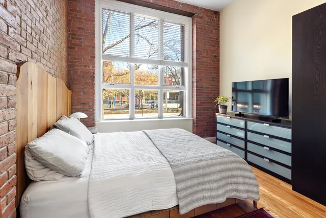 a kitchen with granite countertop a table chairs stove and cabinets