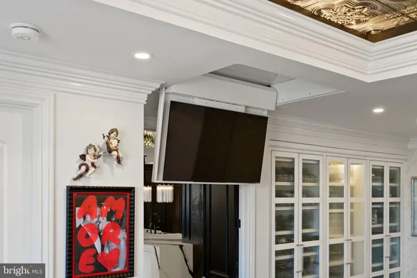 a spacious bedroom with a bed and wooden floor