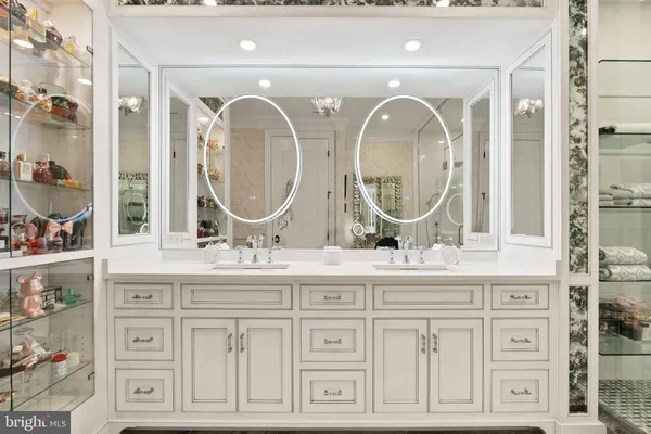 a bathroom with a sink a vanity and a mirror