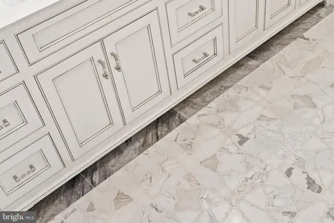 a kitchen with stainless steel appliances granite countertop a sink and a refrigerator